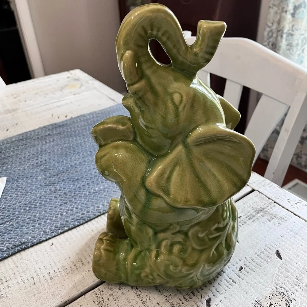 Elephant ceramic- Green Glaze Sitting with Floral Design 10 1/2” euc